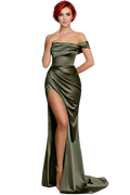 Woman wearing a green off-shoulder gown with a high slit on a white background