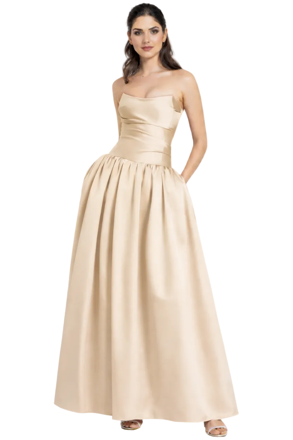 Woman wearing a gold strapless gown on a white background