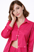 Woman wearing a bright pink shirt on a white background