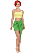 Woman wearing a yellow top and green skirt on a white background