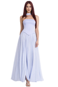 Woman wearing a light blue strapless gown on a white background