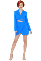 Woman wearing a bright blue dress with a white background