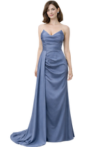 Woman wearing a blue strapless gown on a white background