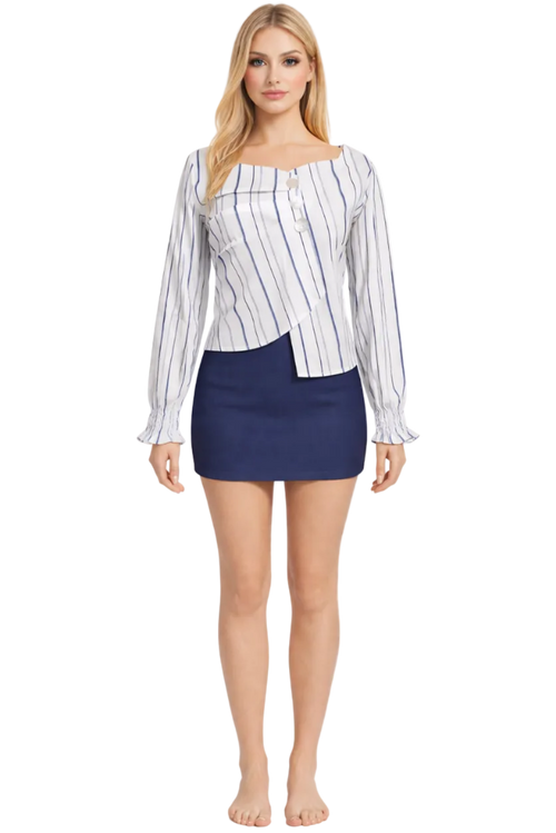 Woman wearing a striped shirt and navy skirt on a white background