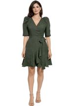 Woman wearing a green dress with a white background