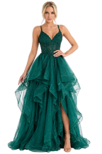 Woman wearing a green evening gown with a white background