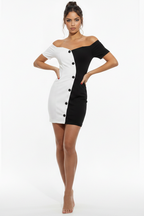 Woman wearing a black and white dress on a white background