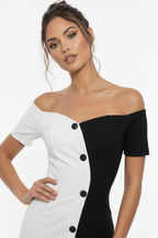 Woman wearing a black and white off-shoulder dress on a white background