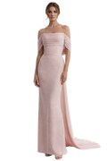 Woman wearing a pink off-shoulder gown on a white background