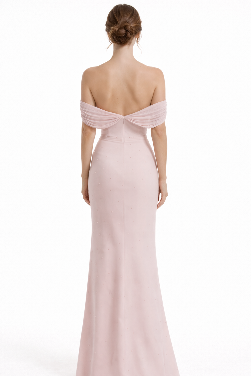 Pink off-shoulder gown with a deep back on a white background