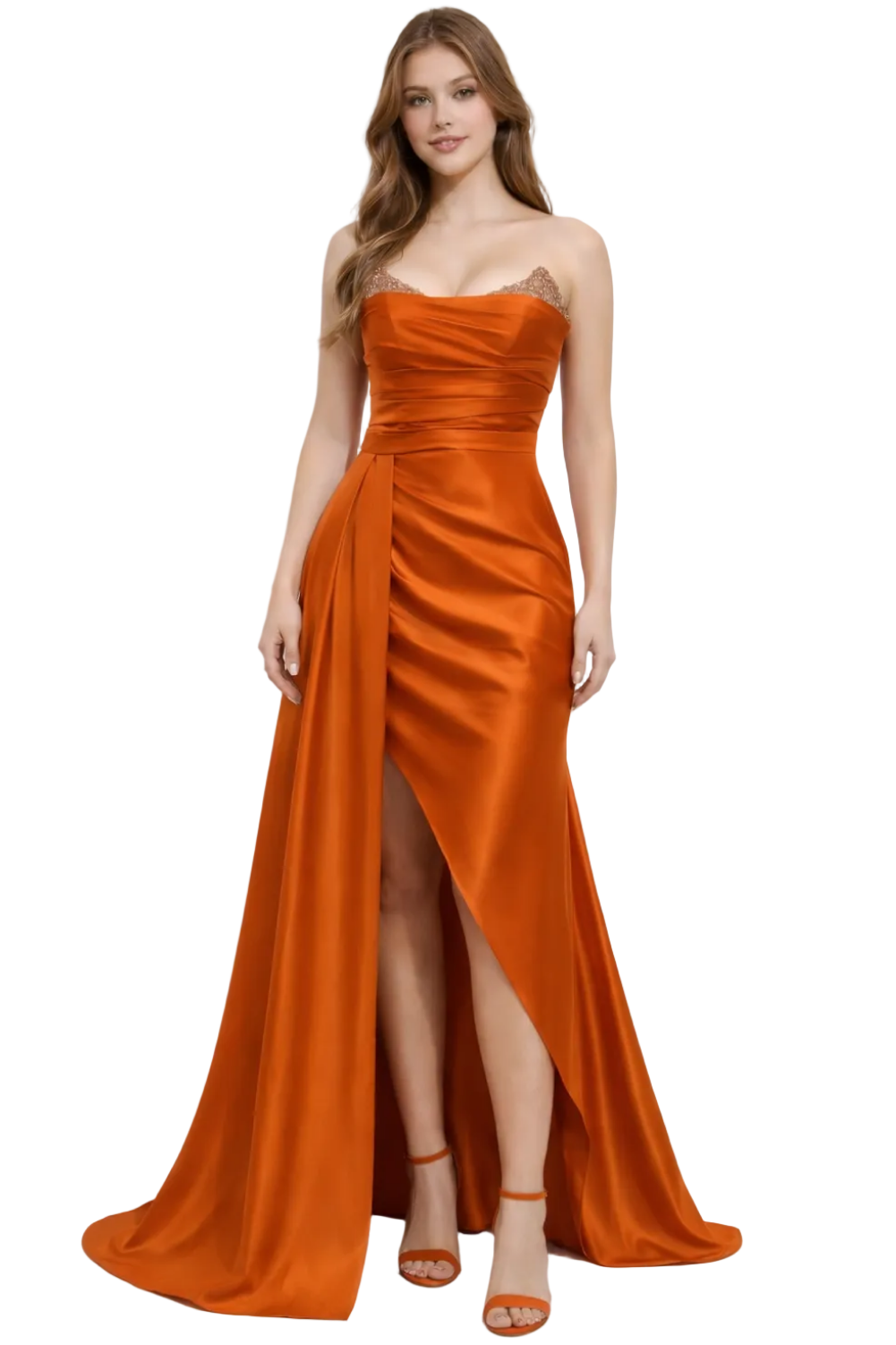 Woman wearing a strapless orange evening gown with a slit on a white background