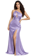 Woman wearing a purple one-shoulder gown with a slit on a white background