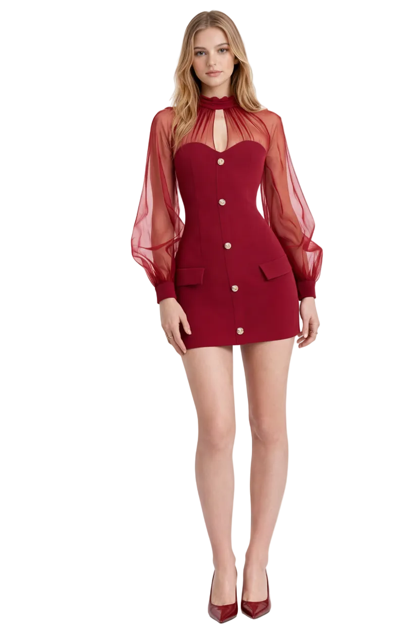 Woman wearing a red dress with sheer sleeves on a white background
