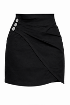 Black skirt with button details on a white background