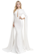 Woman wearing a white evening gown with long sleeves on a white background
