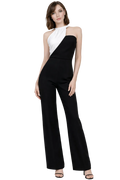 Woman wearing a black and white jumpsuit on a white background
