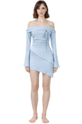 Woman wearing a light blue off-shoulder dress on a white background